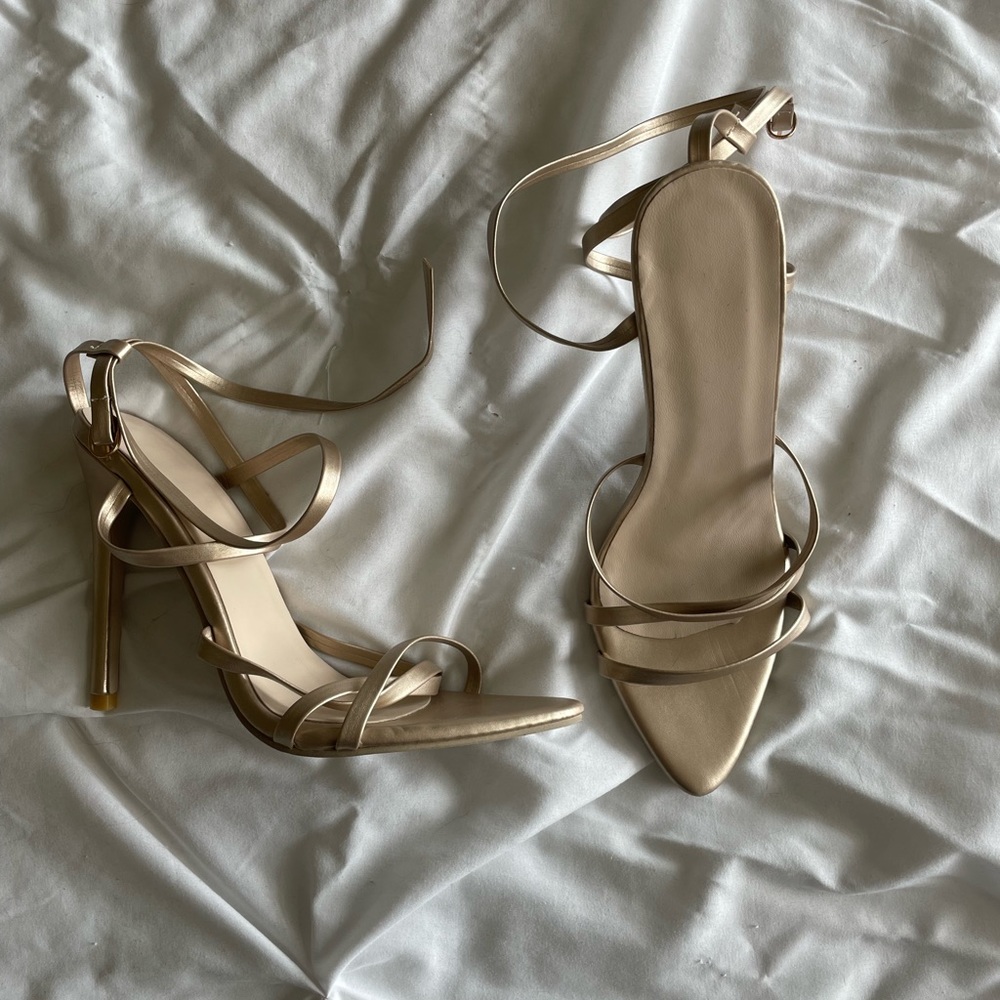 Gold colored strapped heels
